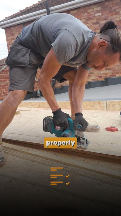Ad still: cutting timber on a flat roof deck